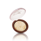 Compact makeup product with open lid on a white background