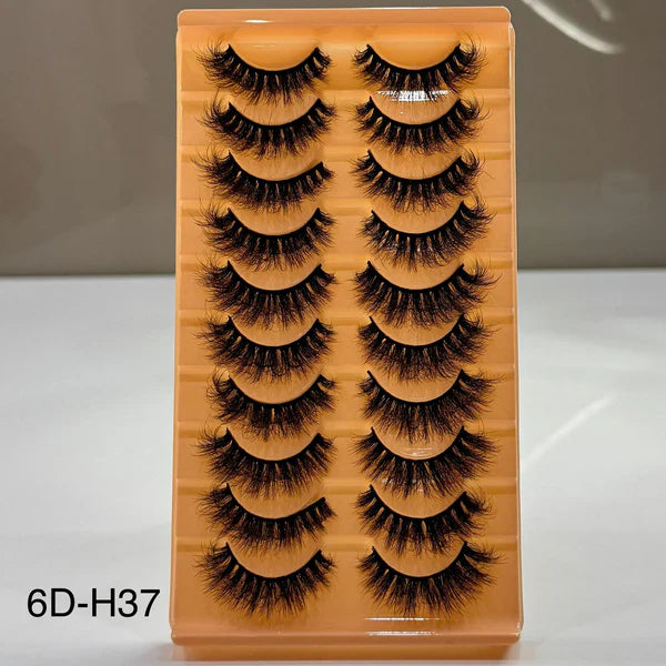 Set of false eyelashes on a wooden display board with '6D-H37' label.