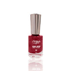 Red nail polish bottle with silver cap on a white background
