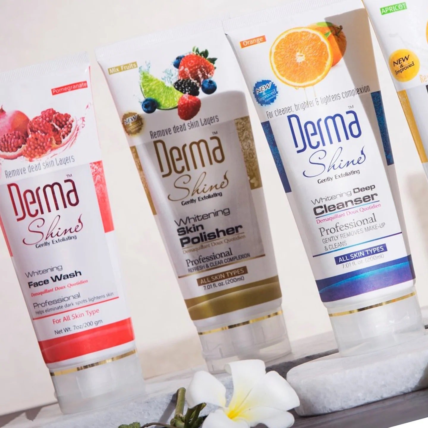 Collection of Derma Shine skincare products on a white background with flowers.