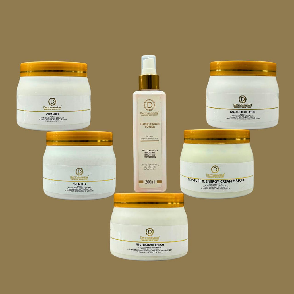 Collection of skincare products with gold lids on a brown background