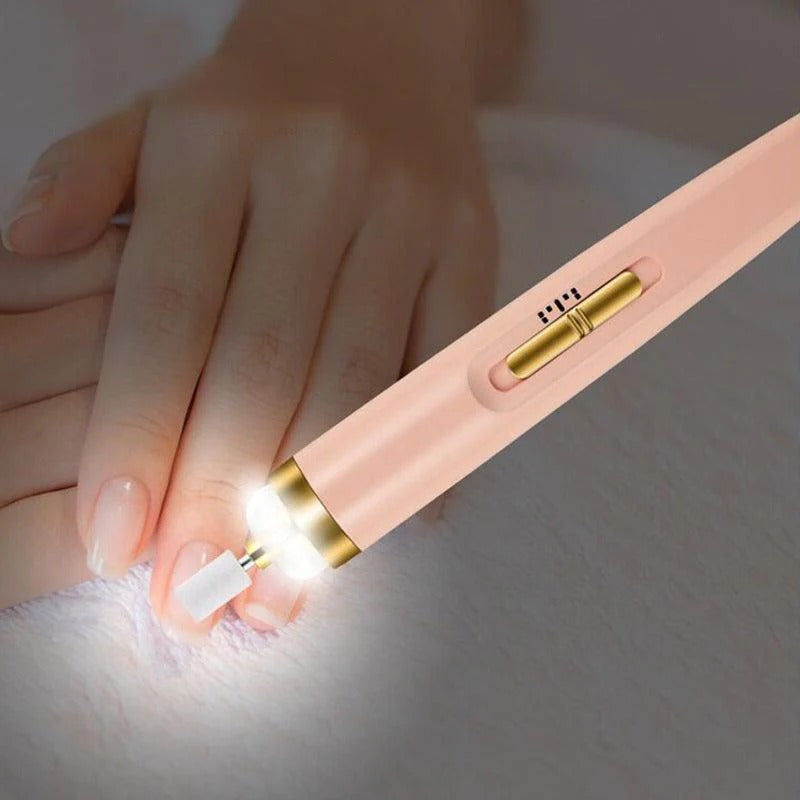 Pink and gold pen with a light on a white surface