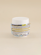 Jar of Golden Girl Cosmetics Mineral Mask on a beige background