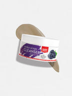 Golden Pearl Double Action Cleanser container with a brush on a white background