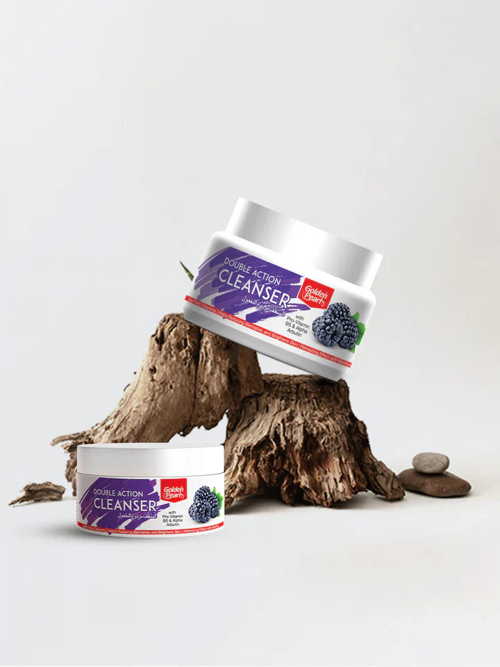Two containers of Golden Pearl Double Action Cleanser on a white background with a wooden log.