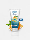 Golden Pearl Flawless Skin Face Wash tube with oranges and leaves on a white background