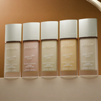 Five bottles of JustGlow Cosmetics Liquid Foundation