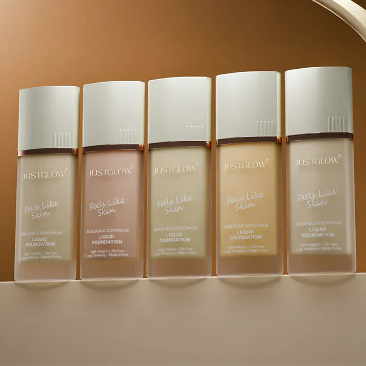 Five bottles of JustGlow Cosmetics Liquid Foundation