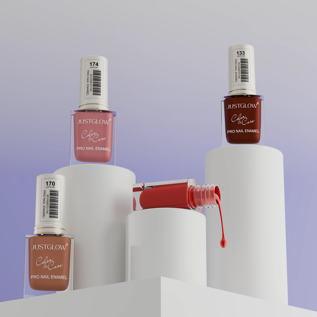 JustGlow nail polish bottles on white cylindrical stands with a gradient purple background