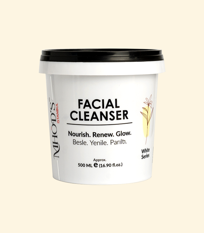 MHOD's Facial Cleanser container with black lid on a beige background