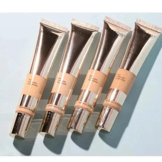 Four cosmetic tubes with a metallic cap on a light blue background