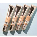 Four cosmetic tubes with a metallic cap on a light blue background