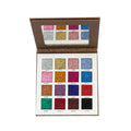 Makeup palette with glittery shades on a white background