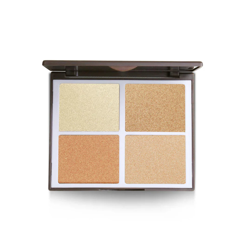 Makeup palette with four different shades of beige on a white background