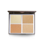Makeup palette with four different shades of beige on a white background