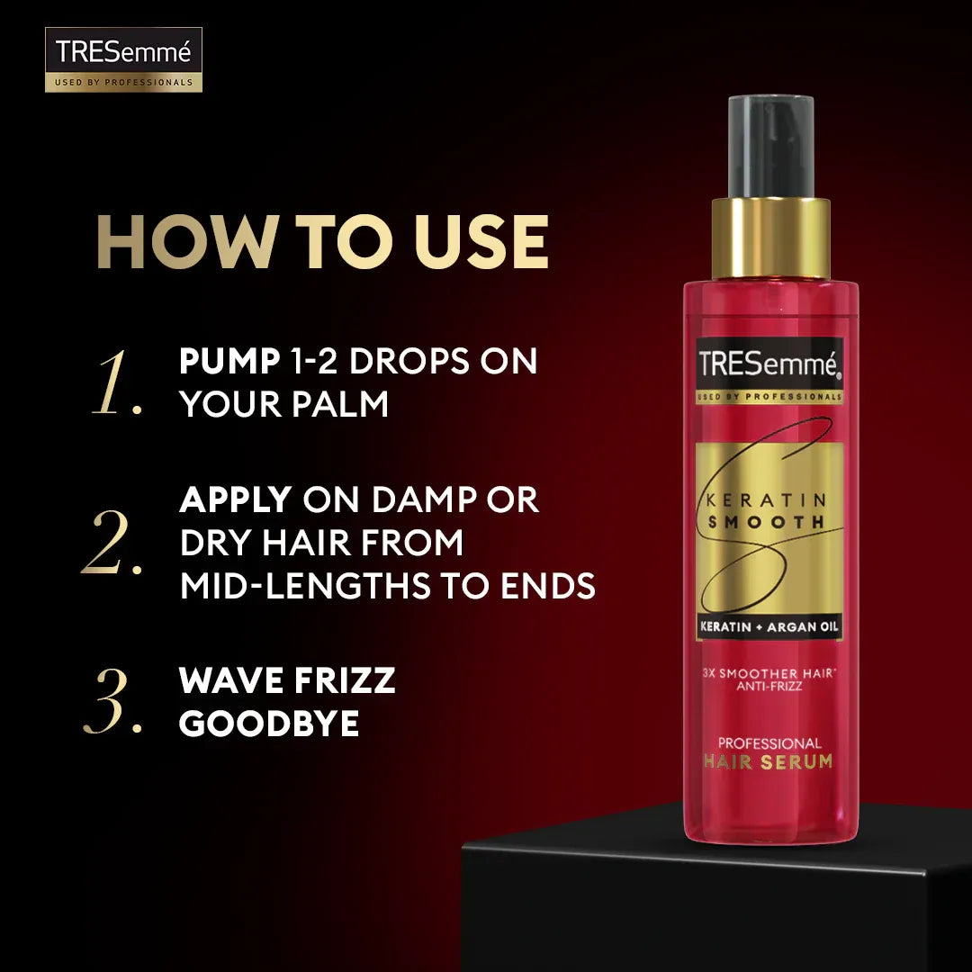 TRESemmé hair serum bottle with usage instructions on a dark background